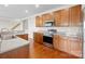 Modern kitchen with stainless steel appliances and wood cabinets at 2936 Westbury Ct, Dallas, NC 28034