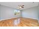 Large bedroom with hardwood floors and ceiling fan at 2950 Penninger Rd, Concord, NC 28025