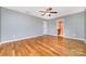 Primary bedroom with hardwood floors and ensuite bathroom access at 2950 Penninger Rd, Concord, NC 28025