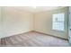 Bright bedroom with carpeted floor and window at 5404 Verona Rd # 36, Charlotte, NC 28213