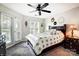 Comfortable bedroom with a king-size bed and access to a private balcony at 703 Southwest Dr, Davidson, NC 28036