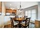 Cozy dining area with a round table and chairs near the kitchen at 703 Southwest Dr, Davidson, NC 28036