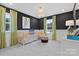 Bedroom with black and white polka dot walls and crib at 8022 Franklin Trail St, Mint Hill, NC 28227