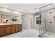 Double vanity bathroom with a large glass shower at 8022 Franklin Trail St, Mint Hill, NC 28227