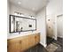 Elegant bathroom featuring double vanity and walk-in shower at 8026 Cedarsmith Ct, Charlotte, NC 28217