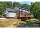 Stunning house exterior with a large deck and attached garage at 9552 Man O War Rd, Indian Land, SC 29707