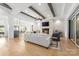 Light-filled living room featuring a stone fireplace and hardwood floors at 10125 Laurier Ln, Huntersville, NC 28078