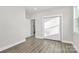 Bedroom with hardwood floors, double door closet, and window at 1016 S Confederate Ave, Rock Hill, SC 29730