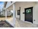 Charming covered porch with gray door and white columns at 1016 S Confederate Ave, Rock Hill, SC 29730