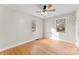 Bright bedroom with hardwood floors and ceiling fan at 103 Airport Rd, Stanley, NC 28164