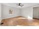 Hardwood floor bedroom with a ceiling fan and window light at 103 Airport Rd, Stanley, NC 28164