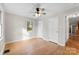 Spacious bedroom with hardwood floors and ceiling fan at 103 Airport Rd, Stanley, NC 28164