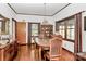 Bright dining room features hardwood floors and built-in hutch at 117 Channel Ln, Belmont, NC 28212