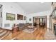 Living room with hardwood floors, built-ins, and views to dining room at 117 Channel Ln, Belmont, NC 28212