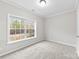 Bright bedroom with carpeted floors and a large window at 139 Fairhaven Ln, Cleveland, NC 27013