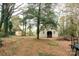 Barn and shed nestled amongst trees at 1614 Statesville Blvd, Salisbury, NC 28144