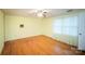 Bright bedroom featuring hardwood floors and a ceiling fan at 1614 Statesville Blvd, Salisbury, NC 28144