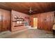 Gathering room with brick fireplace and wood paneling at 1614 Statesville Blvd, Salisbury, NC 28144