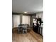 Kitchen with white cabinets and a round dining table at 212 Camp Rotary Rd, Gastonia, NC 28052