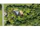 Aerial view showcasing a house on a wooded lot near a road at 2754 Crowders Creek Rd, Gastonia, NC 28052