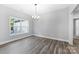 Bright dining room with hardwood floors and a large window, offering natural light at 2754 Crowders Creek Rd, Gastonia, NC 28052