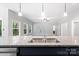 Modern kitchen island with granite countertop and stainless steel sink at 2754 Crowders Creek Rd, Gastonia, NC 28052