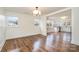 Open concept dining room with hardwood floors and kitchen view at 5204 Dellinger Cir, Cherryville, NC 28021