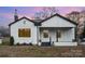 Charming white house with gray accents and a covered porch at 5204 Dellinger Cir, Cherryville, NC 28021