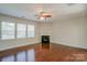 Spacious living room with hardwood floors, fireplace and lots of natural light at 6142 Berewick Commons Pkwy, Charlotte, NC 28278