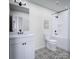 Clean bathroom with a shower/tub combo and patterned floor tiles at 7117 Short Stirrup Ln, Mint Hill, NC 28227