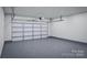 Attached garage with automatic door opener at 7117 Short Stirrup Ln, Mint Hill, NC 28227