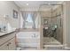 Bathroom with soaking tub and walk-in shower at 7543 Hamilton Bridge Rd, Charlotte, NC 28278