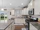 Kitchen with granite countertops, white cabinets, and a center island at 7543 Hamilton Bridge Rd, Charlotte, NC 28278