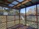 Wooden back porch with lattice and backyard view at 7800 Highbanks Ct, Charlotte, NC 28212