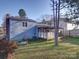 House exterior and backyard with shed at 7800 Highbanks Ct, Charlotte, NC 28212