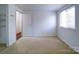 Spacious bedroom with neutral carpeting and large window at 7800 Highbanks Ct, Charlotte, NC 28212