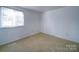 Spacious bedroom with neutral walls and carpeted floor at 7800 Highbanks Ct, Charlotte, NC 28212