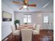 Dining area with hardwood floors, a ceiling fan, and white chairs at 7800 Highbanks Ct, Charlotte, NC 28212