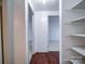 Hallway with built-in shelving and access to bedrooms at 7800 Highbanks Ct, Charlotte, NC 28212