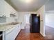 Modern kitchen with stainless steel appliances and white cabinets at 7800 Highbanks Ct, Charlotte, NC 28212