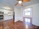 Kitchen with white cabinets, laminate flooring, and stainless steel appliances at 7800 Highbanks Ct, Charlotte, NC 28212