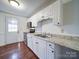 Kitchen with stainless steel appliances and white cabinets at 7800 Highbanks Ct, Charlotte, NC 28212