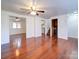 Spacious living room with hardwood floors and access to kitchen at 7800 Highbanks Ct, Charlotte, NC 28212