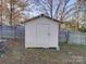 White storage shed in backyard at 7800 Highbanks Ct, Charlotte, NC 28212