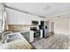 Bright kitchen with white cabinets, granite counters, and stainless steel appliances at 860 W Marion St, Shelby, NC 28150