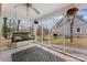 Relaxing screened porch with a swing and backyard view at 860 W Marion St, Shelby, NC 28150