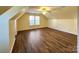 Spacious bonus room with hardwood floors and multiple windows at 9718 Mitchell Glen Dr, Charlotte, NC 28277