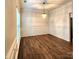 Formal dining room with hardwood floors, wainscoting, and chandelier at 9718 Mitchell Glen Dr, Charlotte, NC 28277