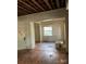 Bedroom with hardwood floors, window, and exposed ceiling beams at 1035 Gibson St, Albemarle, NC 28001