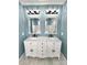 Elegant bathroom with double vanity, large mirrors, and updated fixtures at 122 Arrowood Ln, Harmony, NC 28634